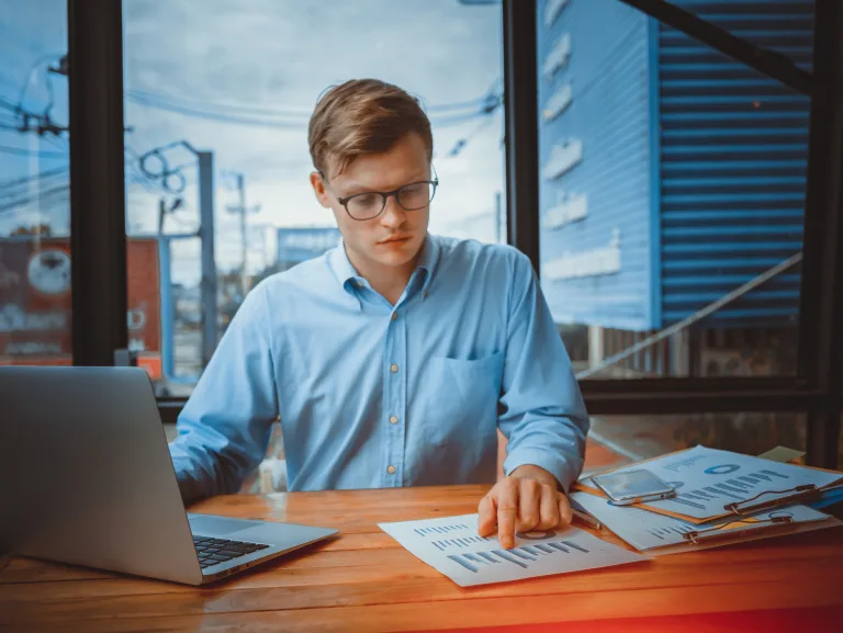 Young,Caucasian,Businessman,In,Denim,Shirt,Is,Standing,In,Office
